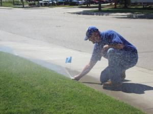 a sprinkler repair Carrollton tech tags a finsihed pop up head